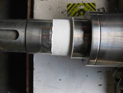 Revêtement en céramique diélectrique sur une portée de roulement d’un rotor électrique.